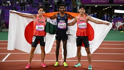 Gold medallists India's Avinash Sable celebrates after winning the men's 3000m steeplechase final with silver medallist Japan's Ryoma Aoki and bronze medallist Japan's Seiya Sunada (REUTERS)