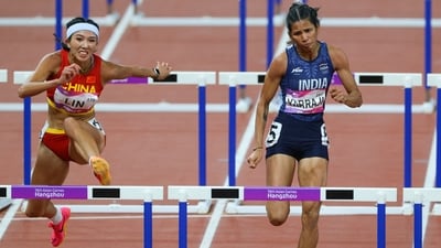 China's Yuwei Lin and India's Jyothi Yarraji in action during the women's 100m hurdles final (REUTERS)