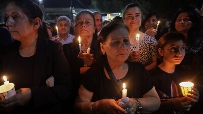 Iraqis attend a candle vigil for the victims of the wedding hall fire, at the church of Mart Shmoni, in Arbil, the capital of the autonomous Kurdish region of northern Iraq, on September 30, 2023. (AFP) Iraqis attend a candle vigil for the victims of the wedding hall fire, at the church of Mart Shmoni, in Arbil, the capital of the autonomous Kurdish region of northern Iraq, on September 30, 2023. (AFP)