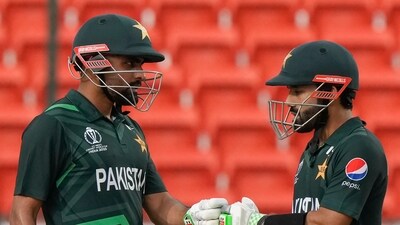 Pakistan's captain Babar Azam, left, and Mohammad Rizwan encourage each other during the ICC Cricket World Cup warmup match between New Zealand and Pakistan (AP) Pakistan's captain Babar Azam, left, and Mohammad Rizwan encourage each other during the ICC Cricket World Cup warmup match between New Zealand and Pakistan (AP)