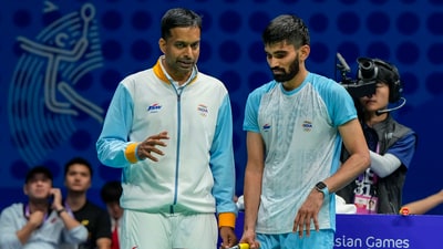 India's Srikanth Kidambi with coach Pullela Gopichand during his match against China's Li Shifeng in the final of Men's Team badminton event at the 19th Asian Games (PTI) India's Srikanth Kidambi with coach Pullela Gopichand during his match against China's Li Shifeng in the final of Men's Team badminton event at the 19th Asian Games (PTI)