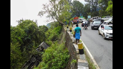 Police personnel at the site where a bus fell into a gorge near Coonoor on Saturday, in Nilgiris district on Sunday. (PTI) Police personnel at the site where a bus fell into a gorge near Coonoor on Saturday, in Nilgiris district on Sunday. (PTI)