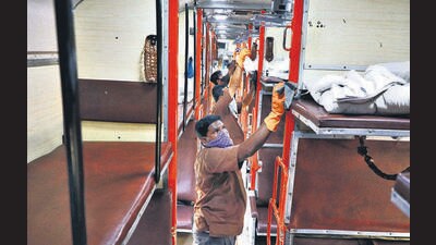 Pune, India - March 21, 2020: Railway employees cleaning the inside of compartments with disinfectants at Ghorapadi in Pune, India, on Saturday, March 21, 2020. (Photo by Rahul Raut/HT PHOTO) Pune, India - March 21, 2020: Railway employees cleaning the inside of compartments with disinfectants at Ghorapadi in Pune, India, on Saturday, March 21, 2020. (Photo by Rahul Raut/HT PHOTO)