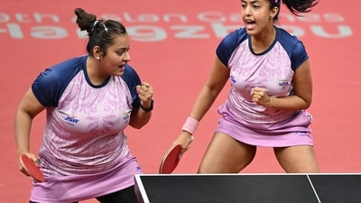 India's Sutirtha Mukherjee (L) and Ayhika Mukherjee (R) celebrate a point as they compete against China's Chen Meng and Wang Yidi in the women's doubles quarter-final table tennis match (AFP) India's Sutirtha Mukherjee (L) and Ayhika Mukherjee (R) celebrate a point as they compete against China's Chen Meng and Wang Yidi in the women's doubles quarter-final table tennis match (AFP)