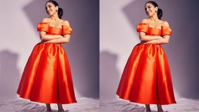 Her gorgeous orange dress is from the shelves of fashion brand Gauri & Nainika and features an off-the-shoulder design, a fitted bodice, a flared hem and a midi length. (Instagram/@bhumipednekar) Her gorgeous orange dress is from the shelves of fashion brand Gauri & Nainika and features an off-the-shoulder design, a fitted bodice, a flared hem and a midi length. (Instagram/@bhumipednekar)