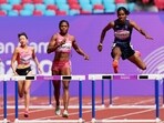 Bahrain's Aminat Oluwaseun Yusuf Jamal, center, competes with India's Vithya Ramraj, right, during the women's 400-meter hurdles heat at the 19th Asian Games Bahrain's Aminat Oluwaseun Yusuf Jamal, center, competes with India's Vithya Ramraj, right, during the women's 400-meter hurdles heat at the 19th Asian Games