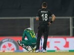 New Zealand's Trent Boult watches as South Africa's Quinton De Kock sits on the ground New Zealand's Trent Boult watches as South Africa's Quinton De Kock sits on the ground