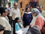 A file photo of Enumerator staff collecting information from residents for a caste-based census in Bihar.