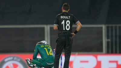 New Zealand's Trent Boult watches as South Africa's Quinton De Kock sits on the ground (AP) New Zealand's Trent Boult watches as South Africa's Quinton De Kock sits on the ground (AP)