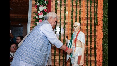 Jammu and Kashmir Lieutenant Governor Manoj Sinha garlands the statue of Mahatma Gandhi during its unveiling on Gandhi Jayanti, at Civil Secretariat, in Srinagar on Monday. (ANI)