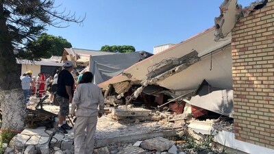 Members of a rescue team and people work at a site where a church roof collapsed during Sunday mass in Ciudad Madero, in Tamaulipas state, Mexico. (Reuters)