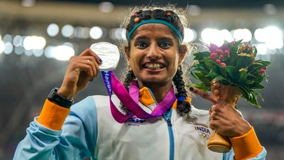 Silver medallist Ancy Sojan Edappilly poses for photo during the presentation ceremony of the women's long jump final at the 19th Asian Games (PTI) Silver medallist Ancy Sojan Edappilly poses for photo during the presentation ceremony of the women's long jump final at the 19th Asian Games (PTI)
