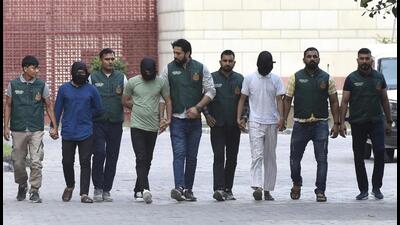 Shahnawaz Alam and two of his alleged associates in Delhi Police custody on Monday. (HT Photo) Shahnawaz Alam and two of his alleged associates in Delhi Police custody on Monday. (HT Photo)