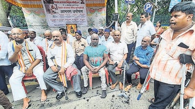 Thane, India - October,02, 2023: Over 200 distressed disabled people staged a protest in front of the TMC on Monday, demanding that they be allowed to set their stalls up at prime locations where they can actually earn a substantial amount.,in Thane, in Mumbai, India, on, Sunday, October , 02, 2023. ( Praful Gangurde / HT Photo ) Thane, India - October,02, 2023: Over 200 distressed disabled people staged a protest in front of the TMC on Monday, demanding that they be allowed to set their stalls up at prime locations where they can actually earn a substantial amount.,in Thane, in Mumbai, India, on, Sunday, October , 02, 2023. ( Praful Gangurde / HT Photo )