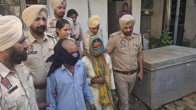 The migrant labourer couple, Sushil Mandal and Meenu, being arrested in Jalandhar on Monday after they confessed to poisoning three of their daughters and stuffing their bodies in the trunk seen in the backdrop. (HT Photo) The migrant labourer couple, Sushil Mandal and Meenu, being arrested in Jalandhar on Monday after they confessed to poisoning three of their daughters and stuffing their bodies in the trunk seen in the backdrop. (HT Photo)