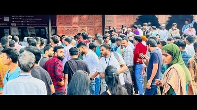 Visitors at gates of Taj Mahal on Sunday. (HT Photo)