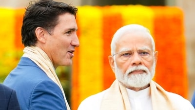 Canada's Prime Minister Justin Trudeau walks past India's Prime Minister Narendra Modi (AP) Canada's Prime Minister Justin Trudeau walks past India's Prime Minister Narendra Modi (AP)
