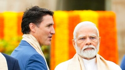 Canada's Prime Minister Justin Trudeau, center, walks past India's Prime Minister Narendra Modi (AP file) Canada's Prime Minister Justin Trudeau, center, walks past India's Prime Minister Narendra Modi (AP file)