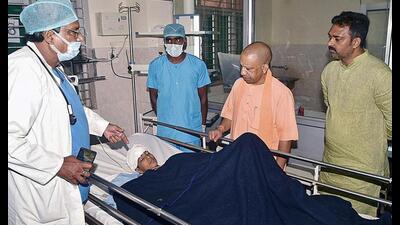 Chief minister Yogi Adityanath meets the child injured in Deoria violence, at the BRD Medical College, in Gorakhpur, Tuesday. (PTI Photo) Chief minister Yogi Adityanath meets the child injured in Deoria violence, at the BRD Medical College, in Gorakhpur, Tuesday. (PTI Photo)