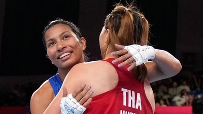 Lovlina Borgohain of India and Baison Maneekon of Thailand embrace each other during women's 66-75Kg Semifinal boxing match at the 19th Asian Games in Hangzhou, China, Hangzhou (AP) Lovlina Borgohain of India and Baison Maneekon of Thailand embrace each other during women's 66-75Kg Semifinal boxing match at the 19th Asian Games in Hangzhou, China, Hangzhou (AP)