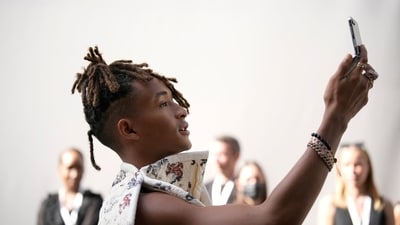 Jaden Smith takes a selfie. Subtle nods, perhaps to stalwarts like Armani Privé couture, could be spotted, but the collection was unmistakably Vuitton. The embrace of a glossy black bodice contrasted with the airy freedom of a voluminous white skirt. Similarly, a gleaming miniskirt seemed to mix between rigidity and flow. (AP) Jaden Smith takes a selfie. Subtle nods, perhaps to stalwarts like Armani Privé couture, could be spotted, but the collection was unmistakably Vuitton. The embrace of a glossy black bodice contrasted with the airy freedom of a voluminous white skirt. Similarly, a gleaming miniskirt seemed to mix between rigidity and flow. (AP)