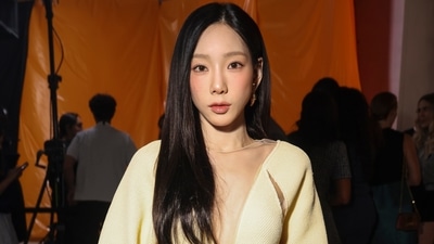 Girls' Generation's Taeyeon chose a girl-next-door look for attending the Louis Vuitton Spring-Summer show in Paris. Dressed in head-to-toe Louis Vuitton, she chose a pastel yellow relaxed fit cardigan, frilled mini skirt, knee-high heeled boots, an LV monogram handbag, striking gold jewels, open locks, and minimal glam. The see-through tulle overlay on the plunging neckline elevated the ensemble. (Vianney Le Caer/Invision/AP) Girls' Generation's Taeyeon chose a girl-next-door look for attending the Louis Vuitton Spring-Summer show in Paris. Dressed in head-to-toe Louis Vuitton, she chose a pastel yellow relaxed fit cardigan, frilled mini skirt, knee-high heeled boots, an LV monogram handbag, striking gold jewels, open locks, and minimal glam. The see-through tulle overlay on the plunging neckline elevated the ensemble. (Vianney Le Caer/Invision/AP)