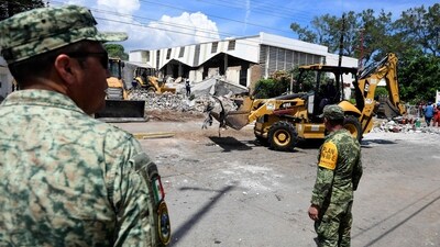 Her 10-year-old daughter was buried in the rubble and remained in intensive care Monday, among 13 people who were still hospitalised.&nbsp; (AFP)