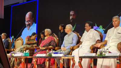 Nirmala Sitharaman attends the Credit Outreach Programme, along with AIADMK leaders TK Amulkandasami and AK Selvaraj, in Coimbatore district of Tamil Nadu on Tuesday. (ANI)