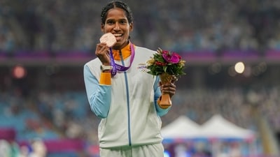 Vithya Ramraj poses with the medal during the presentation ceremony of the Women's 400m Hurdles Final at the 19th Asian Games (PTI)