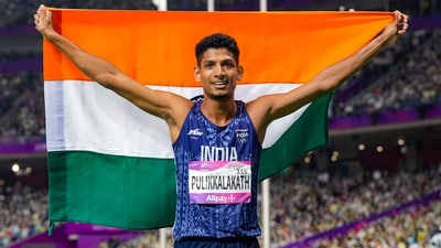 Mohammed Afsal Pulikkalakath waves the national flag after finishing second in the Men's 800m Final event at the 19th Asian Games, in Hangzhou, China (PTI)