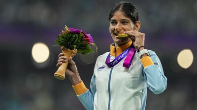 Gold medallist Parul Chaudhary pose for photo during the presentation ceremony of the Women's 5000m final event at the 19th Asian Games in Hangzhou, China (PTI) Gold medallist Parul Chaudhary pose for photo during the presentation ceremony of the Women's 5000m final event at the 19th Asian Games in Hangzhou, China (PTI)