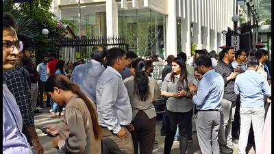 People gather outside their offices after tremors were felt in New Delhi on Tuesday. (Ajay Aggarwal/HT) People gather outside their offices after tremors were felt in New Delhi on Tuesday. (Ajay Aggarwal/HT)