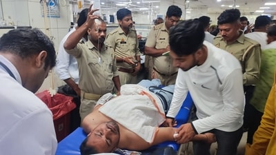 An injured person brought in for treatment after firing incident on Monday. (HT Photo) An injured person brought in for treatment after firing incident on Monday. (HT Photo)