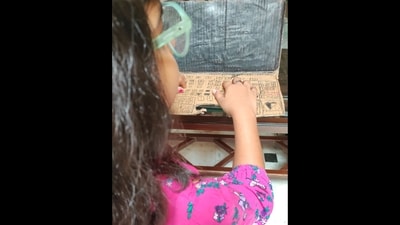 The image shows the girl using the 'laptop' she built after being denied access to the real one. (X/@LadyPeraltaa) The image shows the girl using the 'laptop' she built after being denied access to the real one. (X/@LadyPeraltaa)