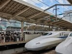 Passengers queue to board a Central Japan Railway Co. (JR Central) Shinkansen bullet train at Tokyo Station in Tokyo, Japan. Japan raises bullet train rail pass prices by 70% for tourists 