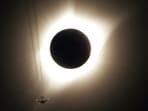 FILE PHOTO: A combination of ten pictures shows the progression of a partial solar eclipse near as a jet plane flies by the total solar eclipse in Guernsey, Wyoming U.S., August 21, 2017.  