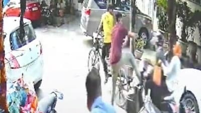 A grab from the CCTV footage gathered from the shop shows Ajay Jha stopping the thieves from running away. (Photo: X/Delhi Police) A grab from the CCTV footage gathered from the shop shows Ajay Jha stopping the thieves from running away. (Photo: X/Delhi Police)