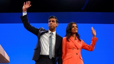 British Prime Minister Rishi Sunak and his wife Akshata Murty greet people on stage, at Britain's Conservative Party's annual conference in Manchester, Britain. (Reuters)