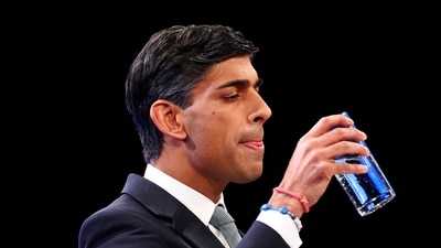 British prime minister Rishi Sunak takes a sip of water as he speaks on stage at Britain's Conservative Party's annual conference in Manchester, Britain. (Reuters)