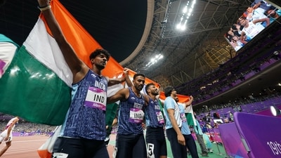 Members of India's team react after winning the Men's 4X400 relay final (REUTERS)