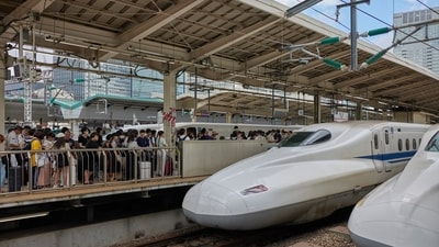 Passengers queue to board a Central Japan Railway Co. (JR Central) Shinkansen bullet train at Tokyo Station in Tokyo, Japan. Japan raises bullet train rail pass prices by 70% for tourists (Photographer: Shoko Takayasu/Bloomberg) Passengers queue to board a Central Japan Railway Co. (JR Central) Shinkansen bullet train at Tokyo Station in Tokyo, Japan. Japan raises bullet train rail pass prices by 70% for tourists (Photographer: Shoko Takayasu/Bloomberg)