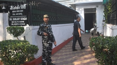 Security personnel guard during Enforcement Directorate's raids at the residence of AAP MP Sanjay Singh, in New Delhi. (PTI) Security personnel guard during Enforcement Directorate's raids at the residence of AAP MP Sanjay Singh, in New Delhi. (PTI)