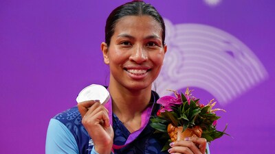 Silver medallist Lovlina Borgohain poses for photo during the presentation ceremony of women's 66-75kg category boxing event at the 19th Asian Games (PTI) Silver medallist Lovlina Borgohain poses for photo during the presentation ceremony of women's 66-75kg category boxing event at the 19th Asian Games (PTI)