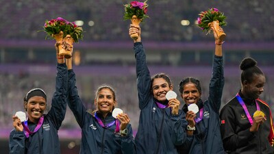 Silver medalist Vithya Ramraj, Prachi, Subha Venkatesan and Aishwarya Kailash Mishra pose for photo during the presentation ceremony of the Women's 4X400m Relay Final event at the 19th Asian Games (PTI)
