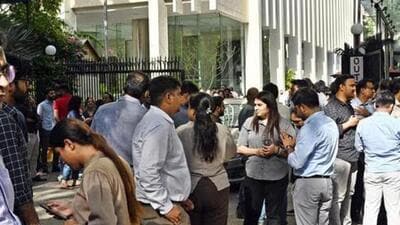 People gather outside their offices after tremors were felt in New Delhi on Tuesday. (Ajay Aggarwal/HT) People gather outside their offices after tremors were felt in New Delhi on Tuesday. (Ajay Aggarwal/HT)