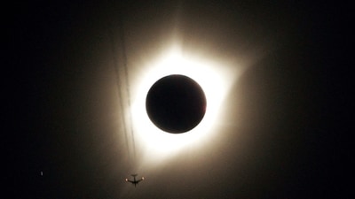 FILE PHOTO: A combination of ten pictures shows the progression of a partial solar eclipse near as a jet plane flies by the total solar eclipse in Guernsey, Wyoming U.S., August 21, 2017. (REUTERS)