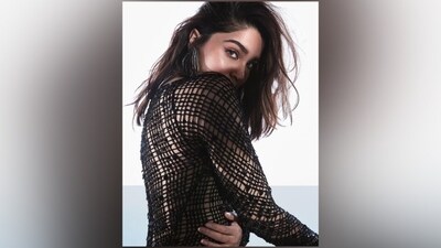 Sharvari chose a statement accessory to style the ensemble. She just opted for OTT [over-the-top] earrings featuring silver and black chain embellishments. Lightly tousled and open silky tresses added an edgy vibe to Sharvari's look.&nbsp; (Instagram)