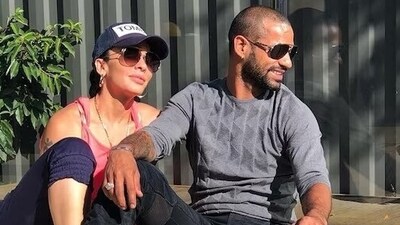 File Photo: Cricketer Shikhar Dhawan (L) with his wife Aesha Mukerji (R) (Twitter)