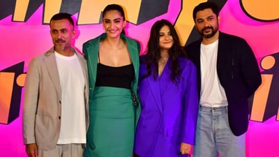 Actor Sonam Kapoor and businessman-husband Anand Ahuja posed alongside her sister, film producer and stylist Rhea Kapoor, and her husband Karan Boolani, who has directed Thank You For Coming. The Kapoor sisters wrote bright green and blue outfits for the screening in Mumbai on Tuesday. Actor Sonam Kapoor and businessman-husband Anand Ahuja posed alongside her sister, film producer and stylist Rhea Kapoor, and her husband Karan Boolani, who has directed Thank You For Coming. The Kapoor sisters wrote bright green and blue outfits for the screening in Mumbai on Tuesday.