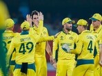 Australia's Pat Cummins, without cap, celebrates the wicket of Pakistan's Imam-ul-Haq during the ICC Cricket World Cup warmup match between Pakistan and Australia in Hyderabad, India, Tuesday, Oct. 3, 2023